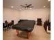 A finished basement features a game room, a billiards table, and lounge seating at 2706 Park Land Ln, Snellville, GA 30078