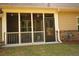 A cozy screened porch with glass panels, ideal for enjoying the outdoors while protected from insects at 2706 Park Land Ln, Snellville, GA 30078