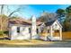 Charming single-story home with a welcoming front porch and nicely maintained landscaping at 5510 Mason Rd, Atlanta, GA 30349