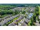 A neighborhood showing many homes, some trees, some tennis courts, and a yellow circle around a property at 828 Olmsted Ln, Duluth, GA 30097
