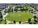 Lush community green space with manicured landscaping, walking paths, and well-maintained lawn at 828 Olmsted Ln, Duluth, GA 30097