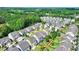 Aerial view with yellow circle around a fenced in backyard with lush green grass and large trees at 828 Olmsted Ln, Duluth, GA 30097