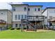 Grassy backyard with patio and deck, perfect for enjoying the outdoors at 828 Olmsted Ln, Duluth, GA 30097