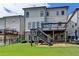 Well-maintained backyard with patio and deck, ideal for outdoor activities and relaxation at 828 Olmsted Ln, Duluth, GA 30097