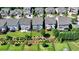 Backyards of several homes with manicured lawns and fences at 828 Olmsted Ln, Duluth, GA 30097