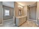 Well-lit bathroom with granite counters, double vanity, and modern finishes at 828 Olmsted Ln, Duluth, GA 30097