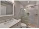 Modern bathroom featuring new shower, vanity with sink, stone floors and modern fixtures at 828 Olmsted Ln, Duluth, GA 30097