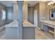 Spacious bathroom with double vanity, granite counters, and cosmetic cabinet at 828 Olmsted Ln, Duluth, GA 30097