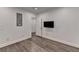 Well-lit bedroom featuring hardwood floors and a closet at 828 Olmsted Ln, Duluth, GA 30097