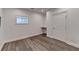 Neutral bedroom featuring built in desk and storage, hardwood floors and natural light at 828 Olmsted Ln, Duluth, GA 30097