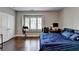 Bedroom featuring hardwood floors, a window seat, and a closet with white doors at 828 Olmsted Ln, Duluth, GA 30097