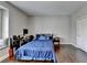 Bedroom featuring hardwood floors, a window seat, a desk, and a bed with blue bedding at 828 Olmsted Ln, Duluth, GA 30097