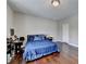 Bedroom featuring hardwood floors, a window seat, and a closet with white doors at 828 Olmsted Ln, Duluth, GA 30097