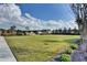 Expansive community lawn with well-maintained landscaping and a view of residential properties at 828 Olmsted Ln, Duluth, GA 30097