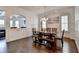 Bright dining room with hardwood floors, wainscoting and modern lighting at 828 Olmsted Ln, Duluth, GA 30097