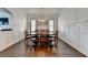 Bright dining room featuring hardwood floors, a stylish chandelier, and decorative wall trim at 828 Olmsted Ln, Duluth, GA 30097