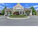 Elegant entrance gate with stone pillars, manicured landscaping, and a security checkpoint at 828 Olmsted Ln, Duluth, GA 30097