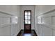 Elegant hallway features a dark hardwood floor, and white wainscotting at 828 Olmsted Ln, Duluth, GA 30097