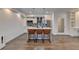 Kitchen featuring an island with seating, stainless steel appliances, and modern lighting at 828 Olmsted Ln, Duluth, GA 30097