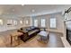Spacious living room has new hardwood floors, a cozy fireplace, and ample natural light at 828 Olmsted Ln, Duluth, GA 30097