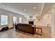 Living room with a fireplace, built-in bookshelves, recessed lighting, and wood-look flooring at 828 Olmsted Ln, Duluth, GA 30097
