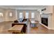 Open living area with modern fireplace, new floors, and a comfortable seating arrangement at 828 Olmsted Ln, Duluth, GA 30097