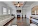 Spacious living room with a fireplace, hardwood floors, and abundant natural light at 828 Olmsted Ln, Duluth, GA 30097