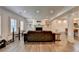 Living room with a fireplace, built-in bookshelves, recessed lighting, and wood-look flooring at 828 Olmsted Ln, Duluth, GA 30097