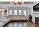 Large living room featuring hardwood floors, a fireplace, and a white leather sofa at 828 Olmsted Ln, Duluth, GA 30097