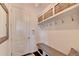 A well-organized mudroom features a bench, storage cubbies, and hooks for coats and bags at 828 Olmsted Ln, Duluth, GA 30097
