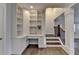 Bright office space featuring built-in shelves, drawers, and desk with hardwood floors at 828 Olmsted Ln, Duluth, GA 30097