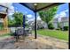 Outdoor patio with stone floor, perfect for gatherings with a beautiful view of the yard at 828 Olmsted Ln, Duluth, GA 30097