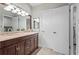 Updated bathroom featuring a double vanity, ample storage, and modern fixtures at 1075 Winding Branch Ln, Atlanta, GA 30338
