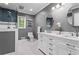 Beautiful bathroom featuring tile flooring, a double sink, and a shower with glass door at 1075 Winding Branch Ln, Atlanta, GA 30338