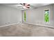 Bright bedroom with large windows, hardwood floors, and a ceiling fan at 1075 Winding Branch Ln, Atlanta, GA 30338
