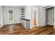 Bedroom with laminate floors, built-in shelves, and adjacent bathroom access at 1075 Winding Branch Ln, Atlanta, GA 30338