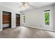 Bright bedroom with large windows, two closets, and neutral paint scheme at 1075 Winding Branch Ln, Atlanta, GA 30338