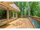 Large wooden deck area overlooking the wooded, tree-filled backyard at 1075 Winding Branch Ln, Atlanta, GA 30338
