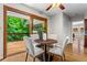 Eat-in kitchen with access to outdoor deck, wood cabinets, and a stainless steel refrigerator at 1075 Winding Branch Ln, Atlanta, GA 30338
