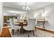 Dining room featuring mirrored wall, chandelier, and natural light at 1075 Winding Branch Ln, Atlanta, GA 30338