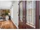 Welcoming foyer with hardwood floors, large windows, and a glimpse into the beautifully decorated living room at 1075 Winding Branch Ln, Atlanta, GA 30338