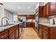 Updated kitchen featuring stainless steel appliances, hardwood floors, granite countertops, and wood cabinets at 1075 Winding Branch Ln, Atlanta, GA 30338