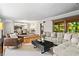 Open concept living room and dining area with hardwood floors and ample natural light at 1075 Winding Branch Ln, Atlanta, GA 30338