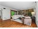 Bright living room featuring a stone accent wall, hardwood floors, and sliding doors to the outside at 1075 Winding Branch Ln, Atlanta, GA 30338