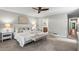 Spacious main bedroom with a ceiling fan, natural light, and neutral tones creating a serene atmosphere at 1075 Winding Branch Ln, Atlanta, GA 30338