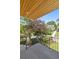 View from private balcony features iron railings, and neighborhood views beyond the tree-lined yard at 1287 Star Ne Dr, Brookhaven, GA 30319