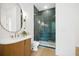Modern bathroom with a glass enclosed shower, marble countertop and bright lighting at 1287 Star Ne Dr, Brookhaven, GA 30319