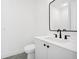 Chic bathroom features a sleek vanity with black hardware and a modern, rectangular mirror at 1287 Star Ne Dr, Brookhaven, GA 30319