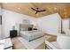 Bright bedroom boasts a wood-paneled ceiling, ceiling fan, neutral furniture and a large window offering verdant views at 1287 Star Ne Dr, Brookhaven, GA 30319