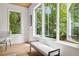 Sunlit room features an inviting bench seat by a large, bright window with beautiful, lush green outdoor views at 1287 Star Ne Dr, Brookhaven, GA 30319
